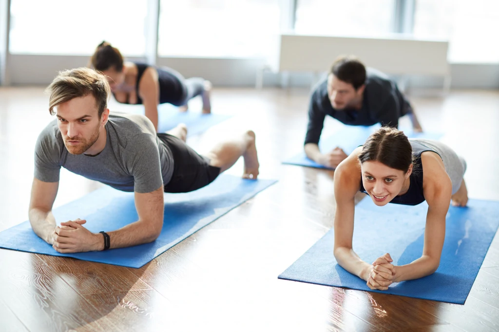 Man and woman doing Pilates