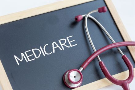 Medicare written on board with stethoscope wrapped around it
