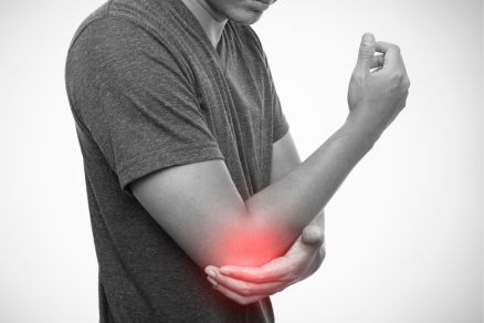 Guy suffering from tennis elbow